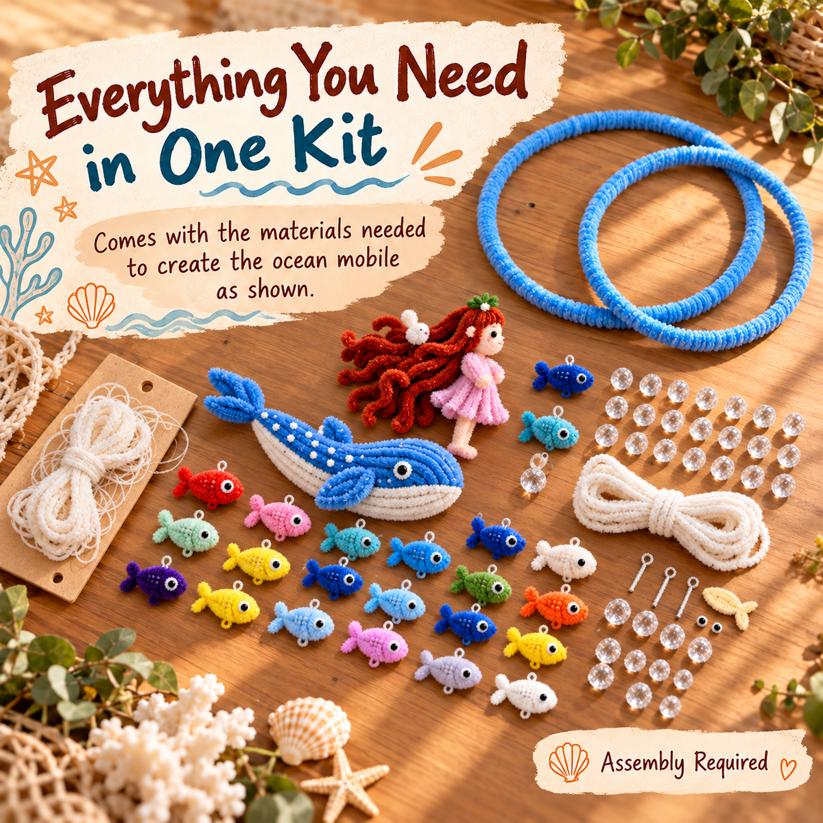 Ocean DIY craft kit components including chenille stem fish, large whale, doll, hanging rings, string and clear beads